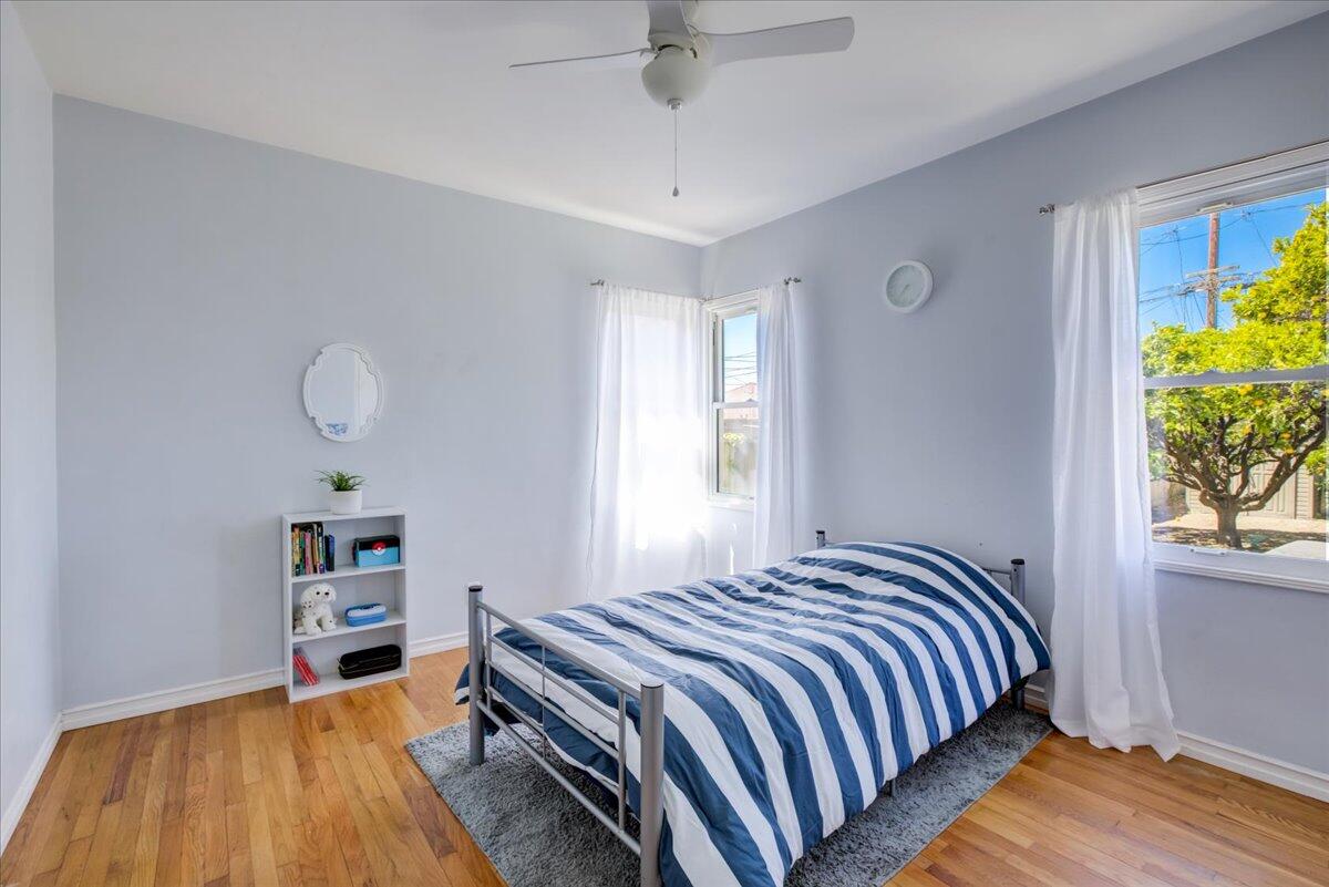 425 Howard Street Ventura, CA 93003 - Photo 25 of 31 a bedroom with a bed and a book shelf