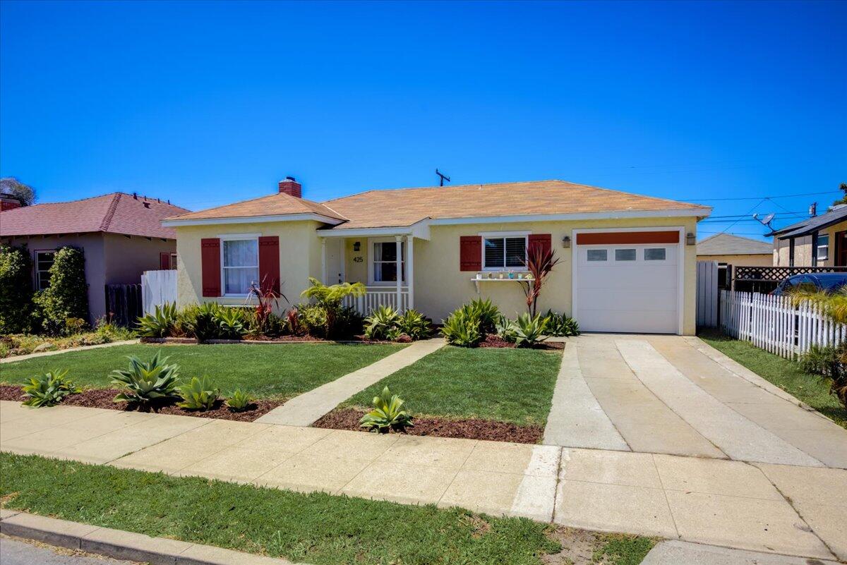 425 Howard Street Ventura, CA 93003 - Photo 3 of 31 a front view of a house with a yard
