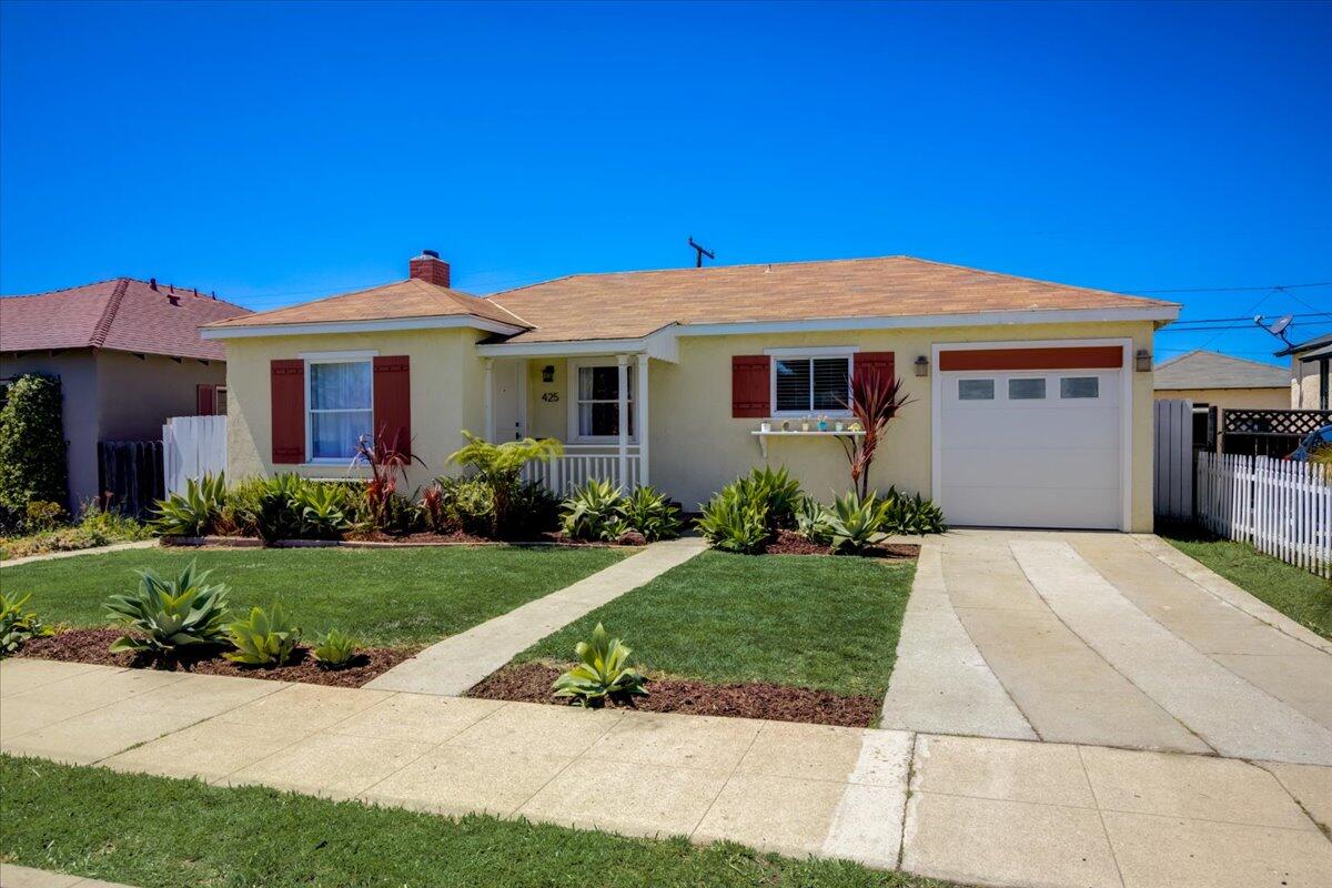 425 Howard Street Ventura, CA 93003 - Photo 4 of 31 a front view of a house with a yard