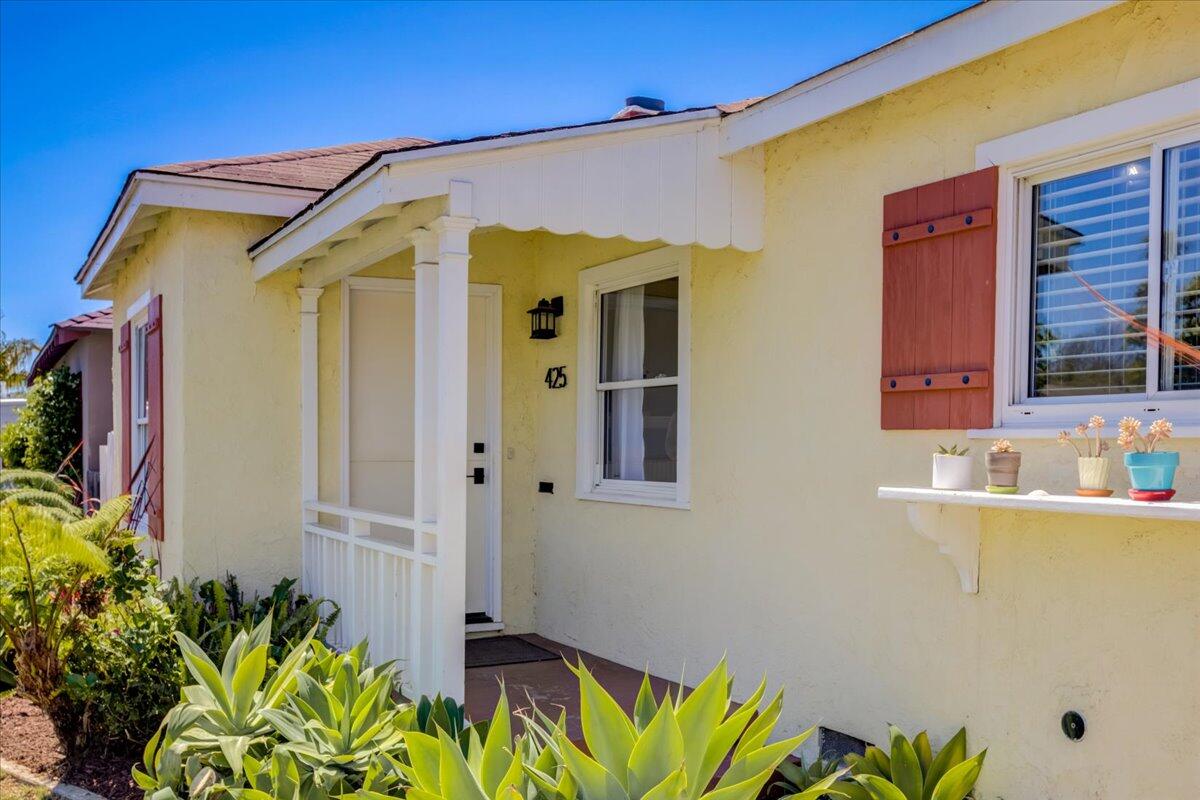 425 Howard Street Ventura, CA 93003 - Photo 7 of 31 a front view of a house with a garden