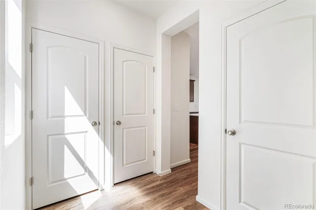 a bathroom with a sink mirror and a toilet