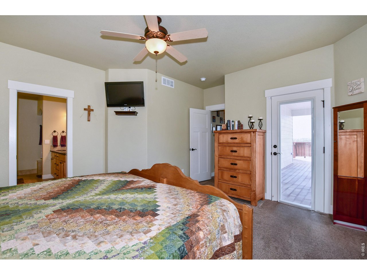 6201 West 13th St Road Greeley, CO 80634 - Photo 22 of 50 Master Suite with blinds in door to oversized deck