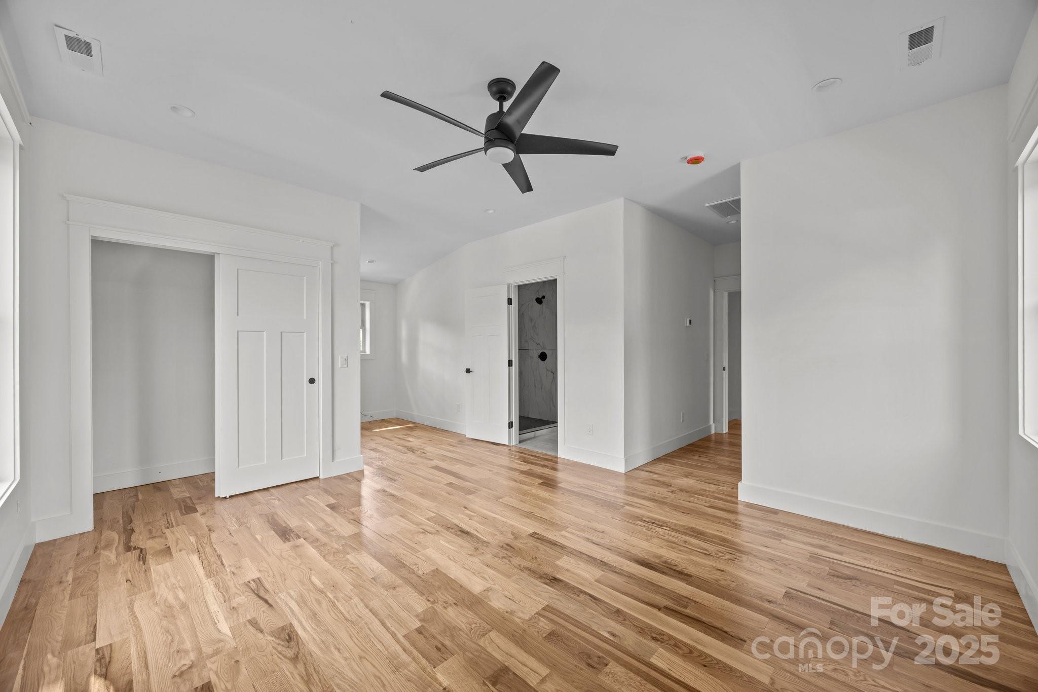 58 Pinedale Road Asheville, NC 28805 - Photo 13 of 24 a view of empty room with wooden floor and ceiling fan