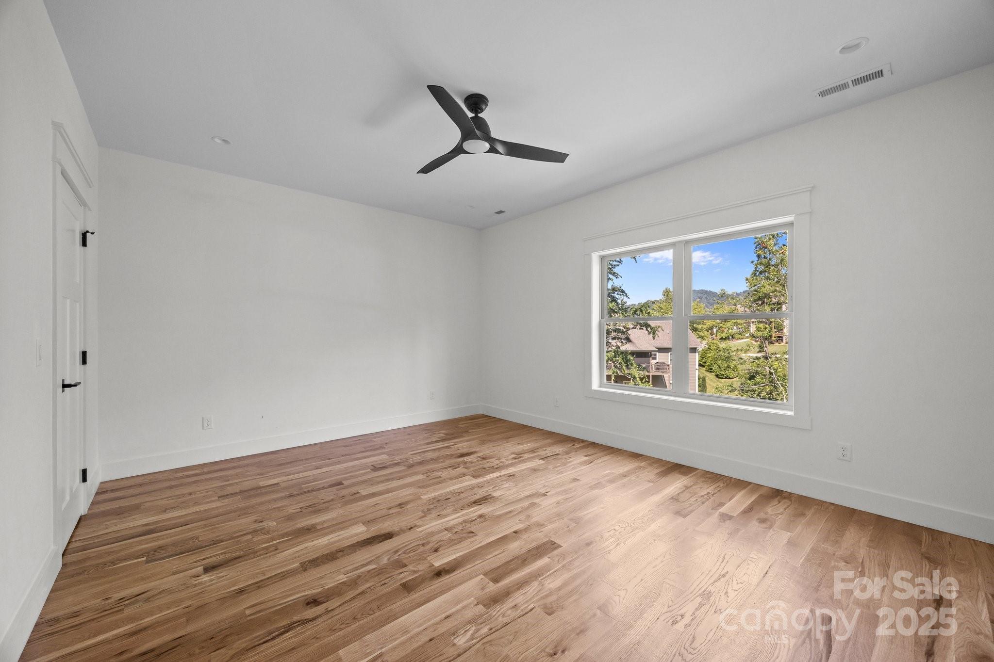 58 Pinedale Road Asheville, NC 28805 - Photo 19 of 24 wooden floor in an empty room with a window