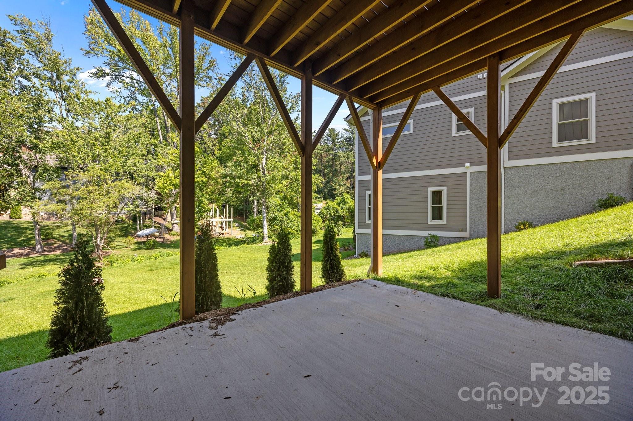 58 Pinedale Road Asheville, NC 28805 - Photo 23 of 24 a view of a house with backyard and a trees