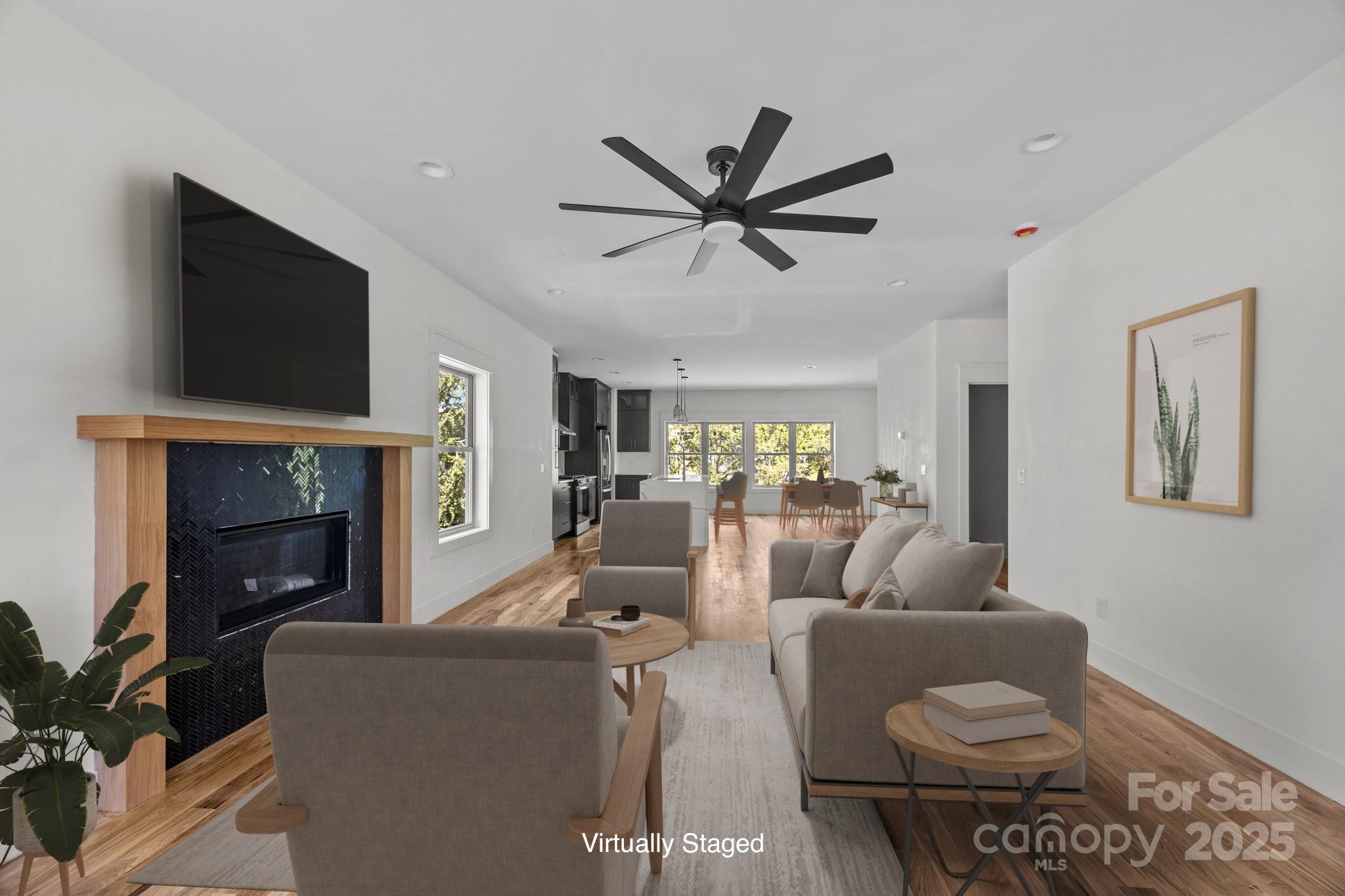 58 Pinedale Road Asheville, NC 28805 - Photo 5 of 24 a living room with furniture a fireplace and a flat screen tv