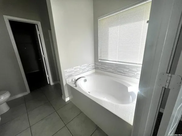 a bathroom with a sink a toilet and a tub