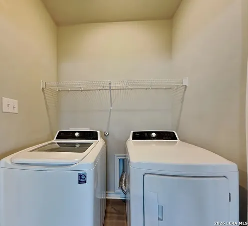 a utility room with dryer and washer