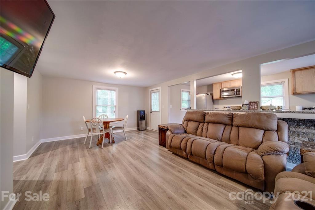 4414 Love Mill Road Monroe, NC 28110 - Photo 23 of 48 a living room with furniture and a flat screen tv