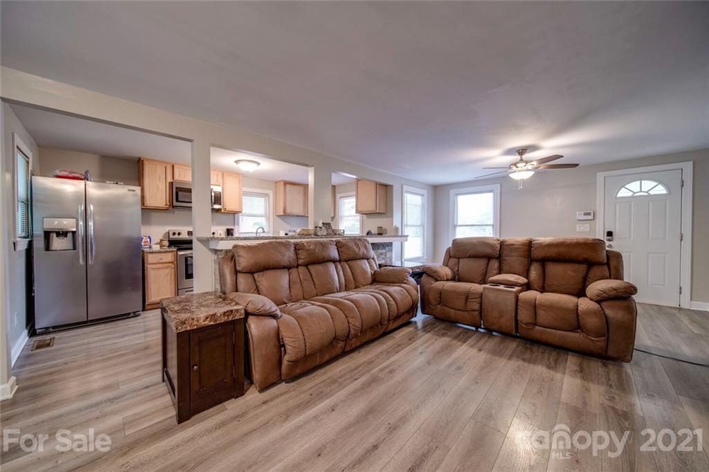 4414 Love Mill Road Monroe, NC 28110 - Photo 29 of 48 a living room with furniture and a wooden floor