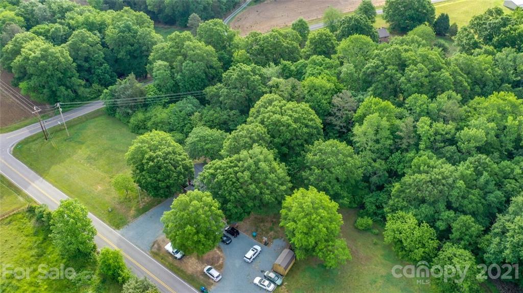 4414 Love Mill Road Monroe, NC 28110 - Photo 4 of 48 an aerial view of a house with pool yard outdoor seating and yard