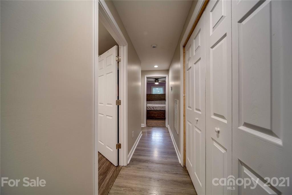 4414 Love Mill Road Monroe, NC 28110 - Photo 31 of 48 a view of hallway with wooden floor