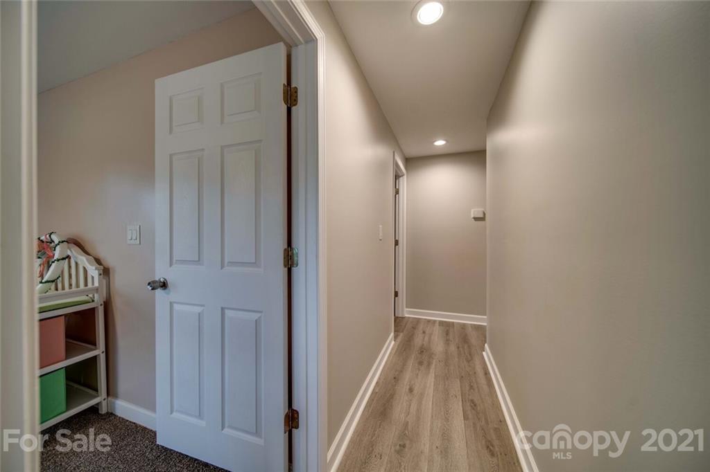 4414 Love Mill Road Monroe, NC 28110 - Photo 40 of 48 a view of hallway with wooden floor