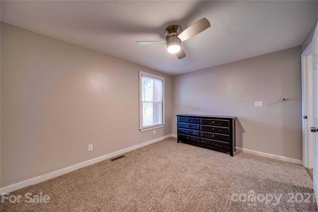 4414 Love Mill Road Monroe, NC 28110 - Photo 48 of 48 an empty room with windows and fan