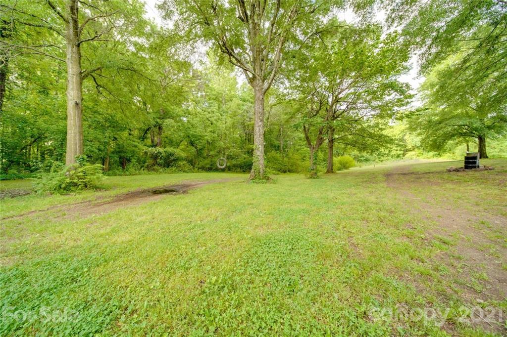 4414 Love Mill Road Monroe, NC 28110 - Photo 6 of 48 a view of a field with an trees