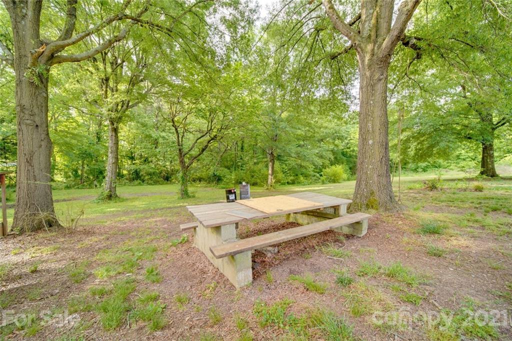 4414 Love Mill Road Monroe, NC 28110 - Photo 7 of 48 a view of backyard with tree