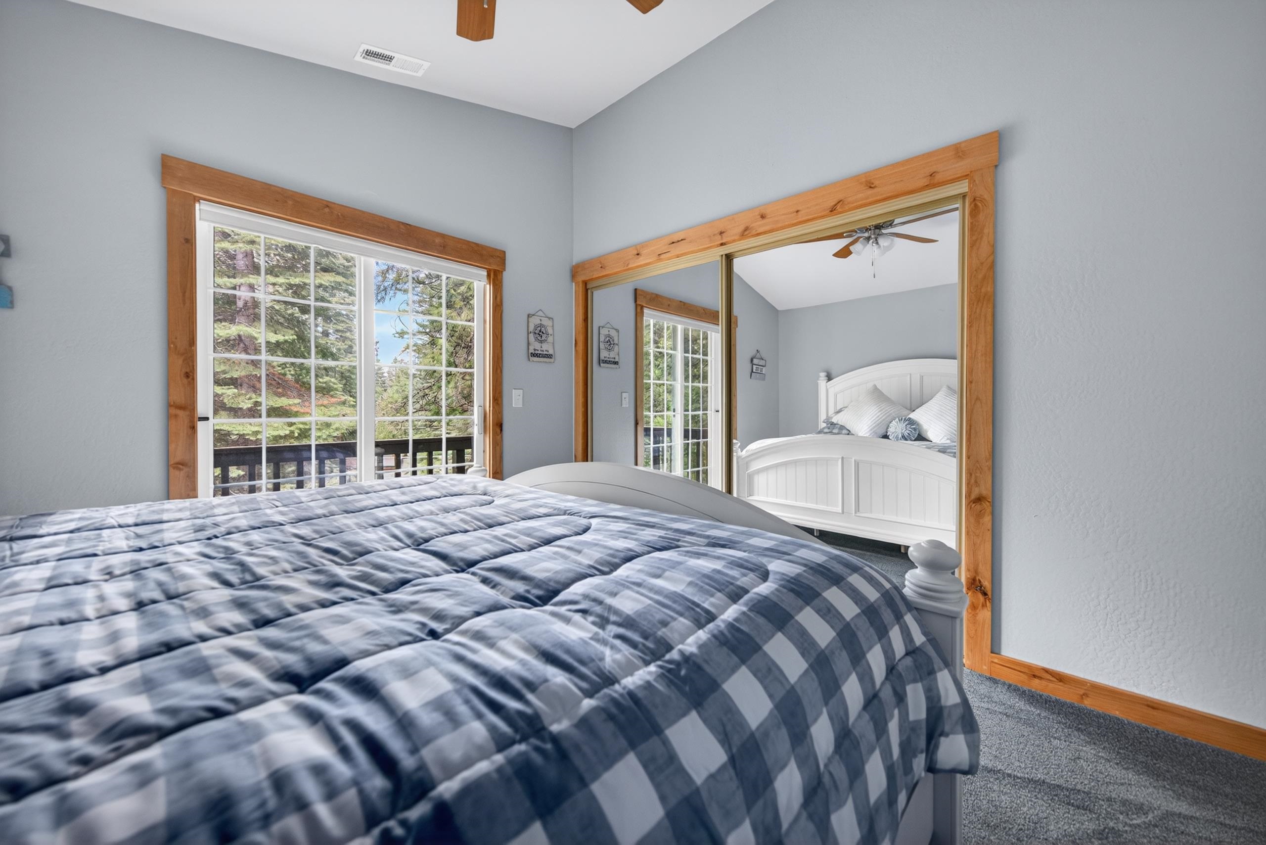1220 Lynx Road Lake Almanor, CA 96137 - Photo 23 of 45 a bedroom with a large bed and a large window