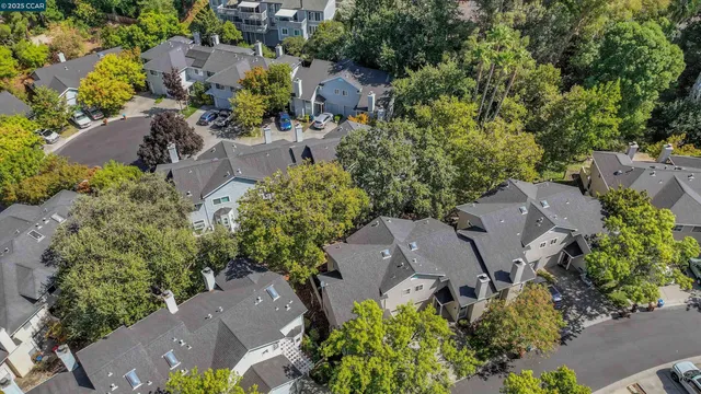 an aerial view of a house with yard