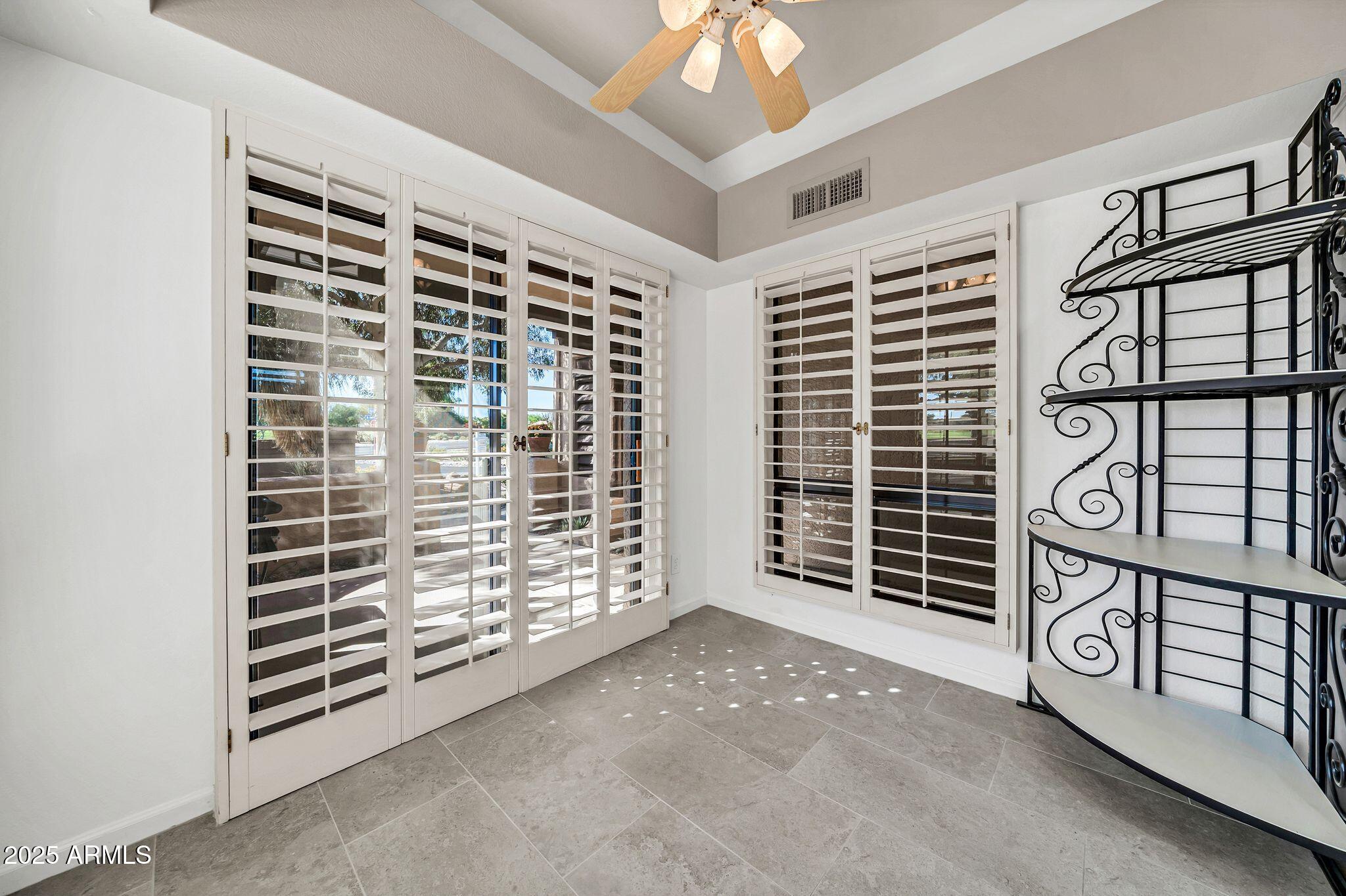 25515 Forest Road, Unit 13 Rio Verde, AZ 85263 - Photo 13 of 37 a view of an empty room with windows