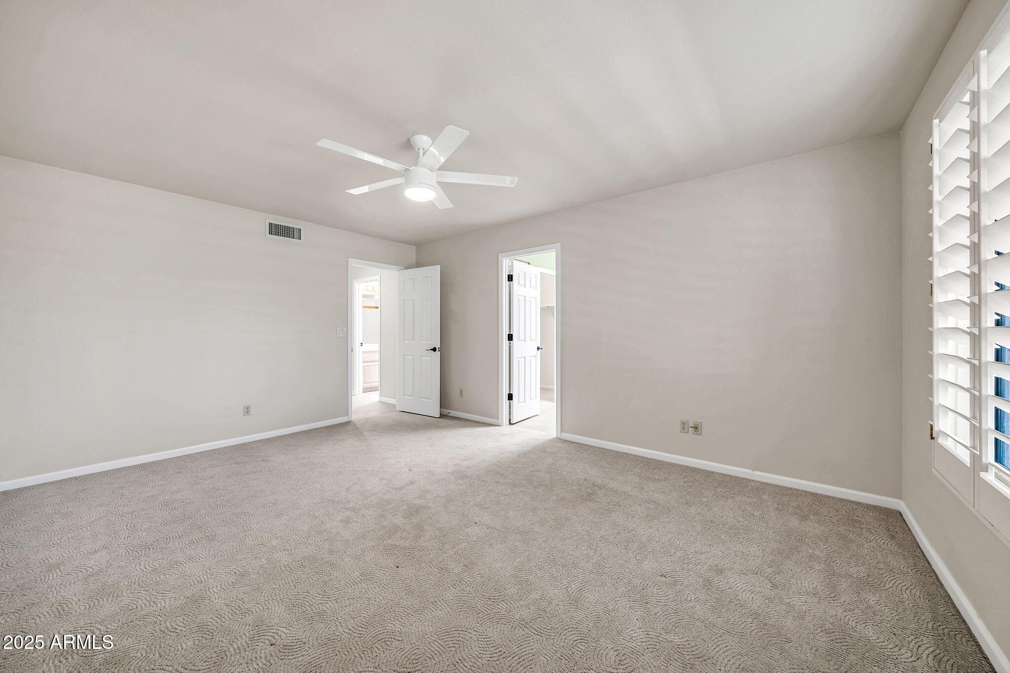 25515 Forest Road, Unit 13 Rio Verde, AZ 85263 - Photo 18 of 37 a view of an empty room with a window