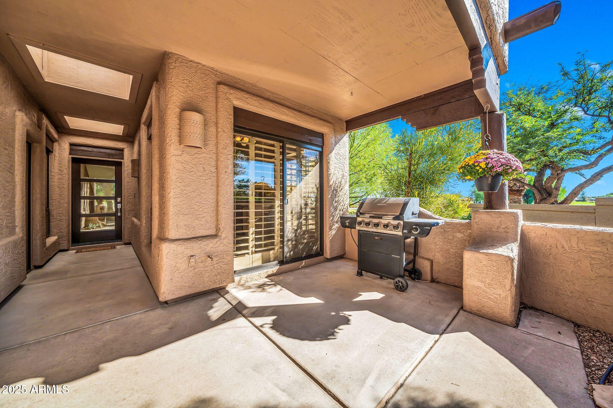 25515 Forest Road, Unit 13 Rio Verde, AZ 85263 - Photo 27 of 37 a view of a patio with couches and potted plants