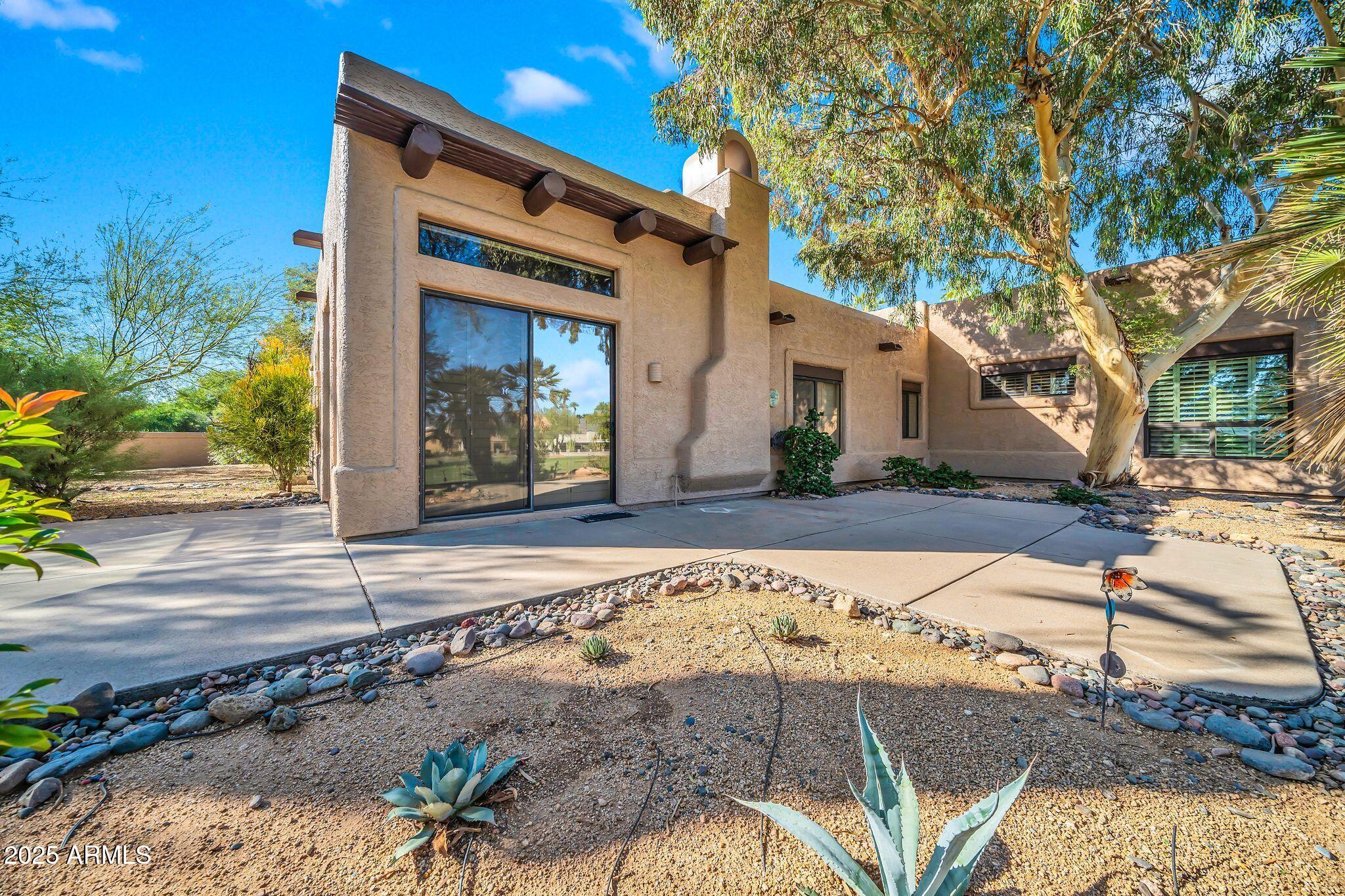 25515 Forest Road, Unit 13 Rio Verde, AZ 85263 - Photo 33 of 37 a front view of a house with garden