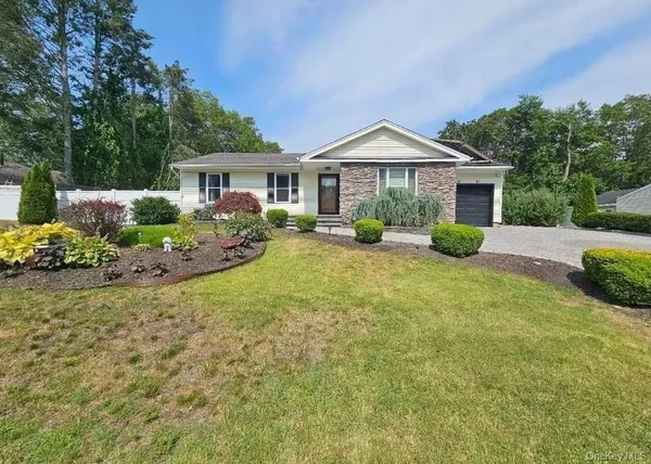 a front view of a house with a garden and porch