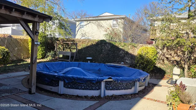 a view of an outdoor sitting area with brick walls