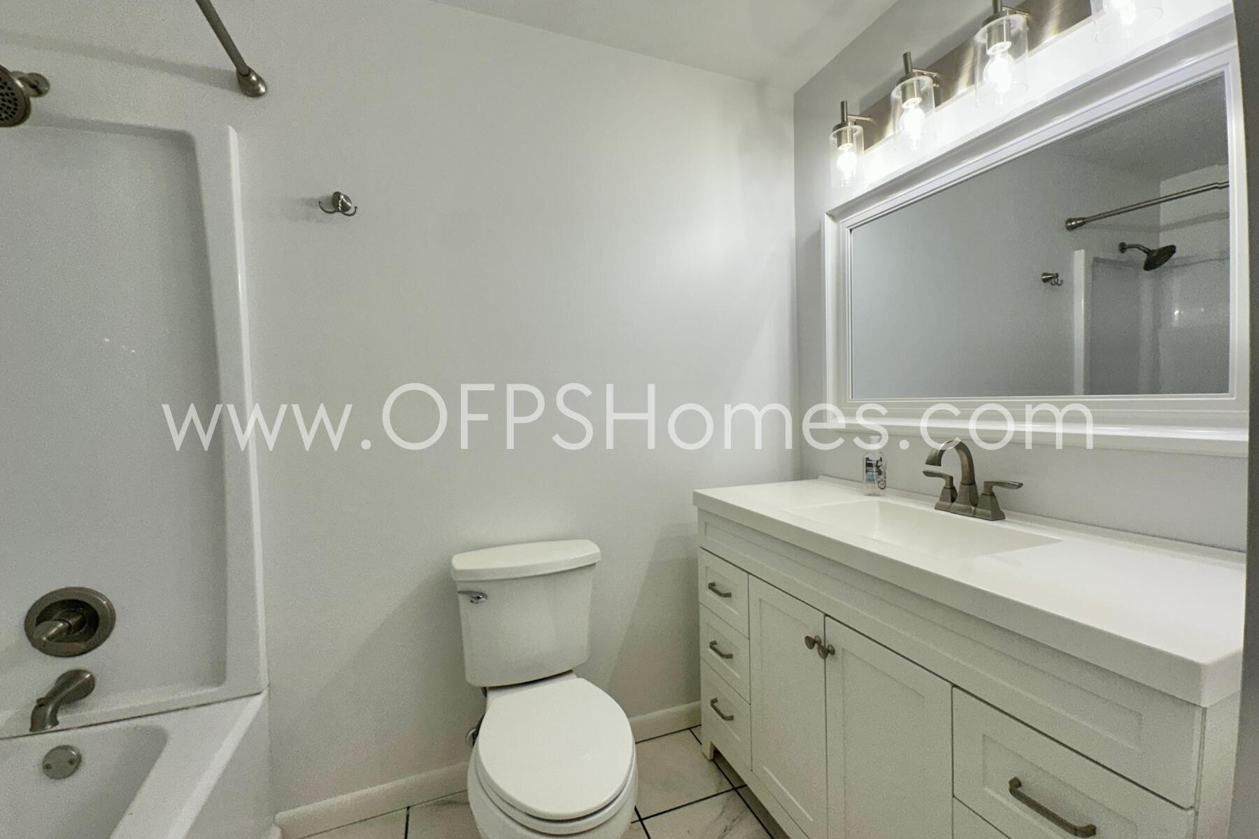 309 Pontevedra Lane Niceville, FL 32578 - Photo 18 of 32 a bathroom with a sink a toilet and a mirror