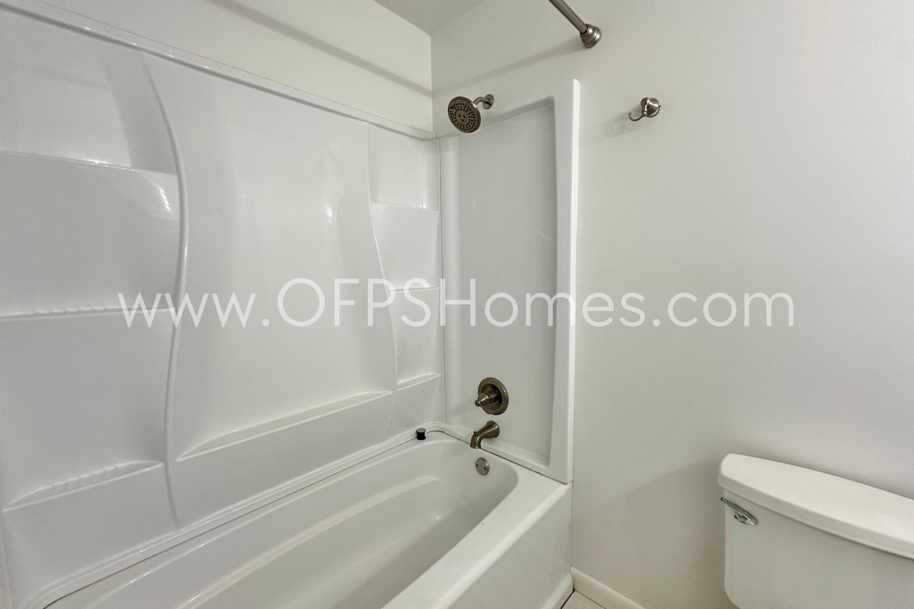 309 Pontevedra Lane Niceville, FL 32578 - Photo 19 of 32 a bathroom with a shower and a toilet