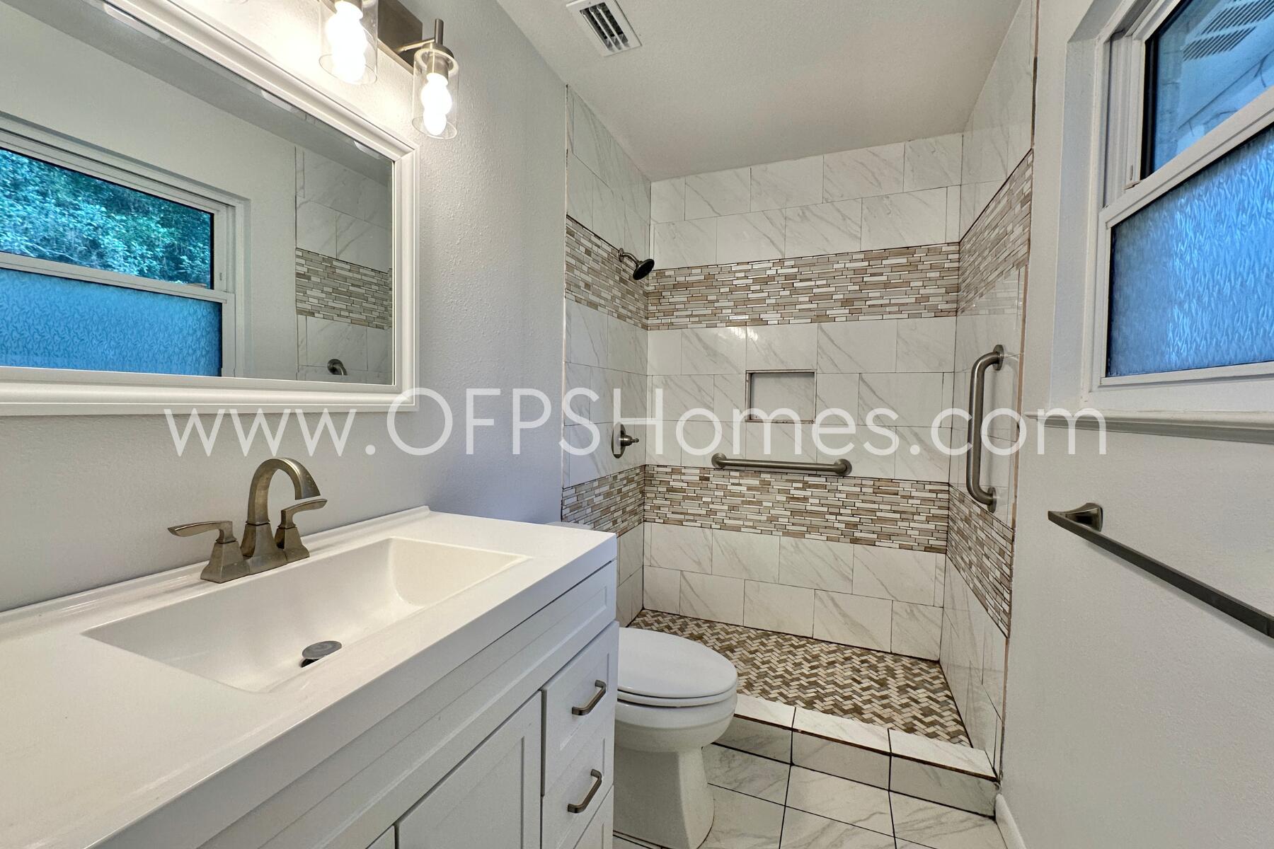 309 Pontevedra Lane Niceville, FL 32578 - Photo 27 of 32 a bathroom with a sink toilet and shower