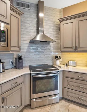 a dining room with furniture a chandelier and window