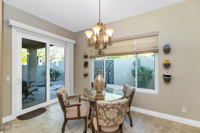 a bedroom with a bed a couch and a flat screen tv