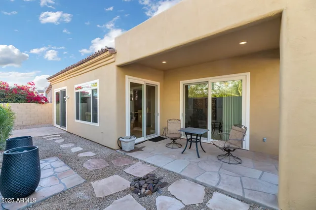 an aerial view of a house with swimming pool