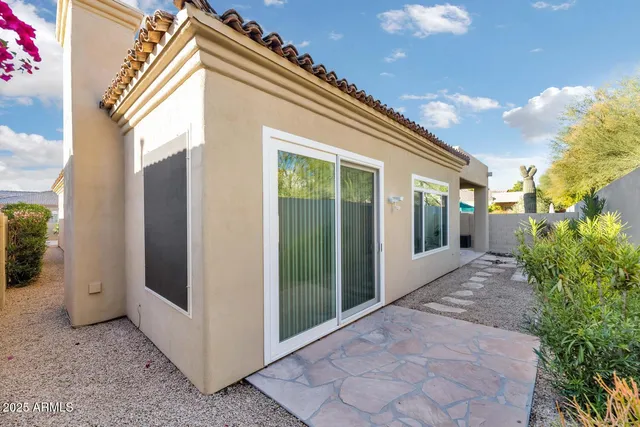 an aerial view of residential houses with outdoor space and parking