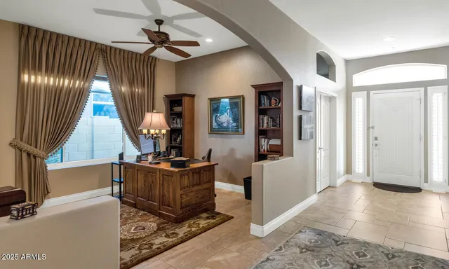 a view of a livingroom with furniture and staircase