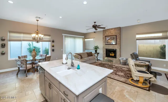 a kitchen with granite countertop cabinets stainless steel appliances and sink
