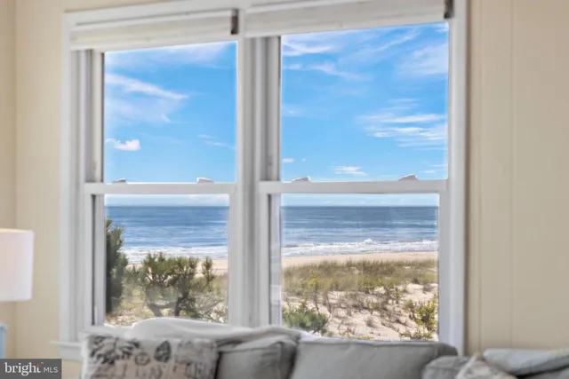 a open kitchen with a table chairs and refrigerator