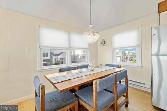 a kitchen with refrigerator and cabinets