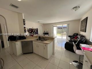 West Kendall Miami, FL 33193 - Photo 14 of 25 a kitchen with a sink and a stove top oven