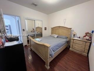 West Kendall Miami, FL 33193 - Photo 17 of 25 a bedroom with a bed and wooden floor