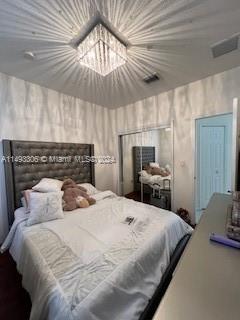 West Kendall Miami, FL 33193 - Photo 18 of 25 a bedroom with a bed and ceiling fan