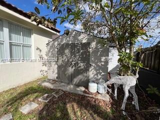 West Kendall Miami, FL 33193 - Photo 21 of 25 a backyard of a house with table and chairs and potted plants