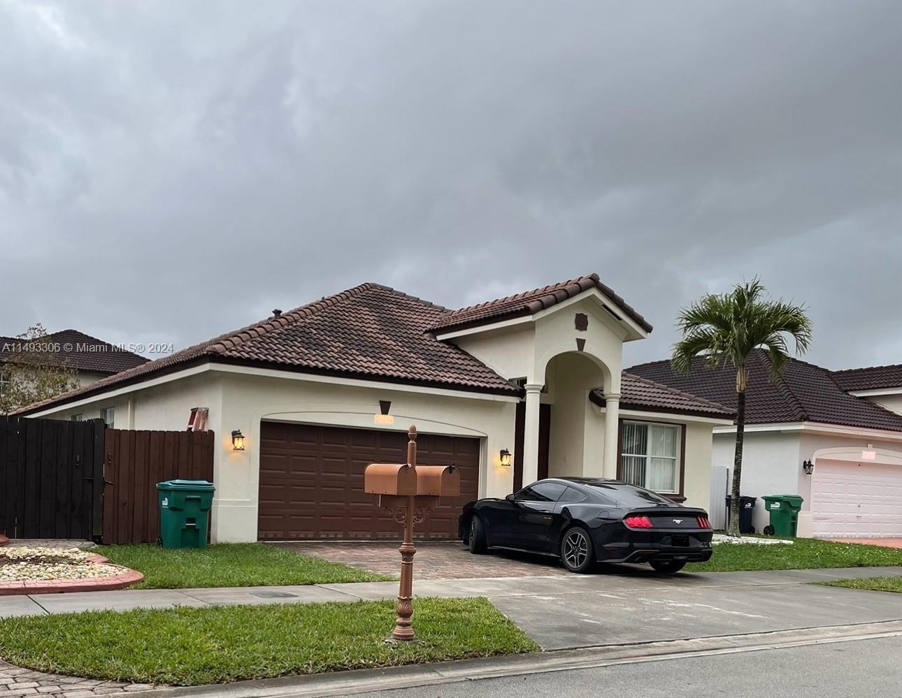 West Kendall Miami, FL 33193 - Photo 3 of 25 a car parked in front of a house