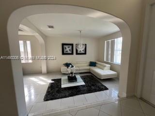 West Kendall Miami, FL 33193 - Photo 5 of 25 a living room with furniture and a painting on the wall