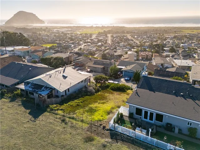 an aerial view of a house with a ocean view