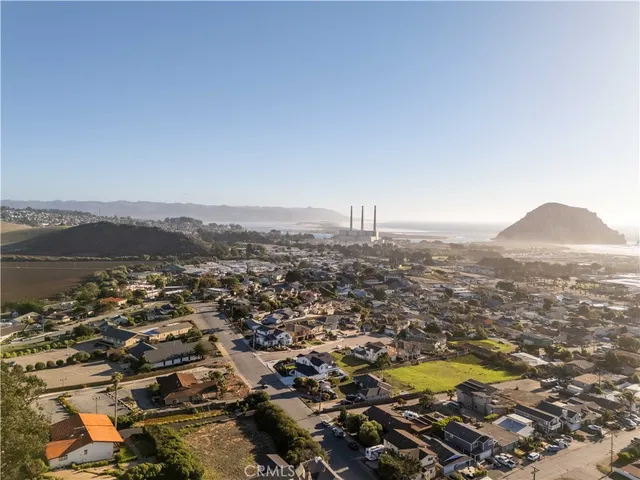 an aerial view of residential house with outdoor space and trees
