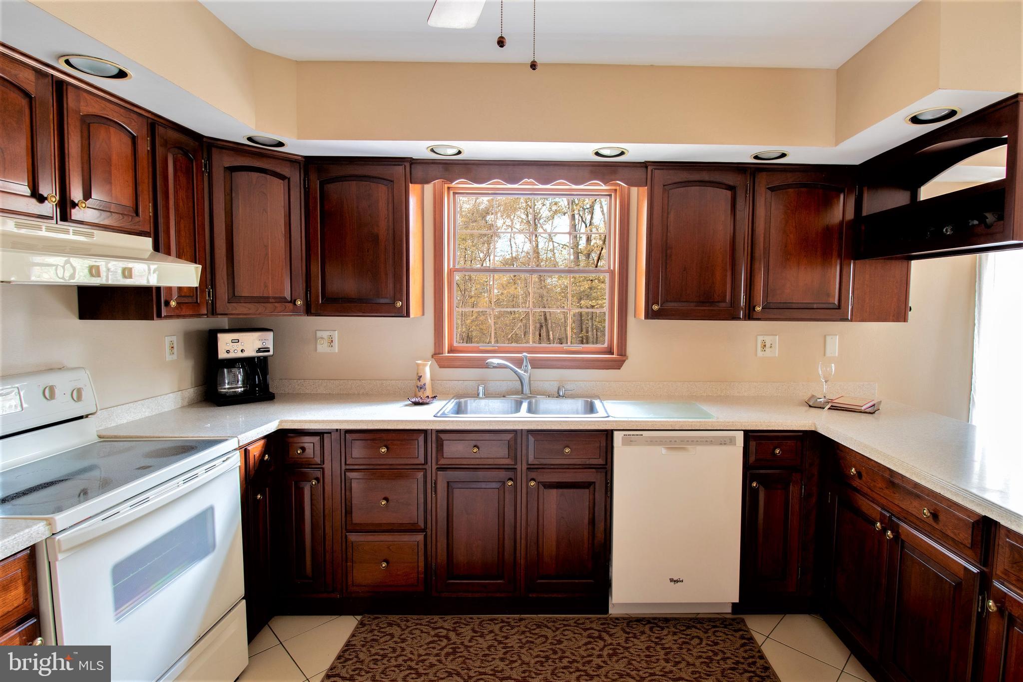 7782 Poplar Grove Road Severn, MD 21144 - Photo 5 of 52 Cherry cabinets, bisque appliances