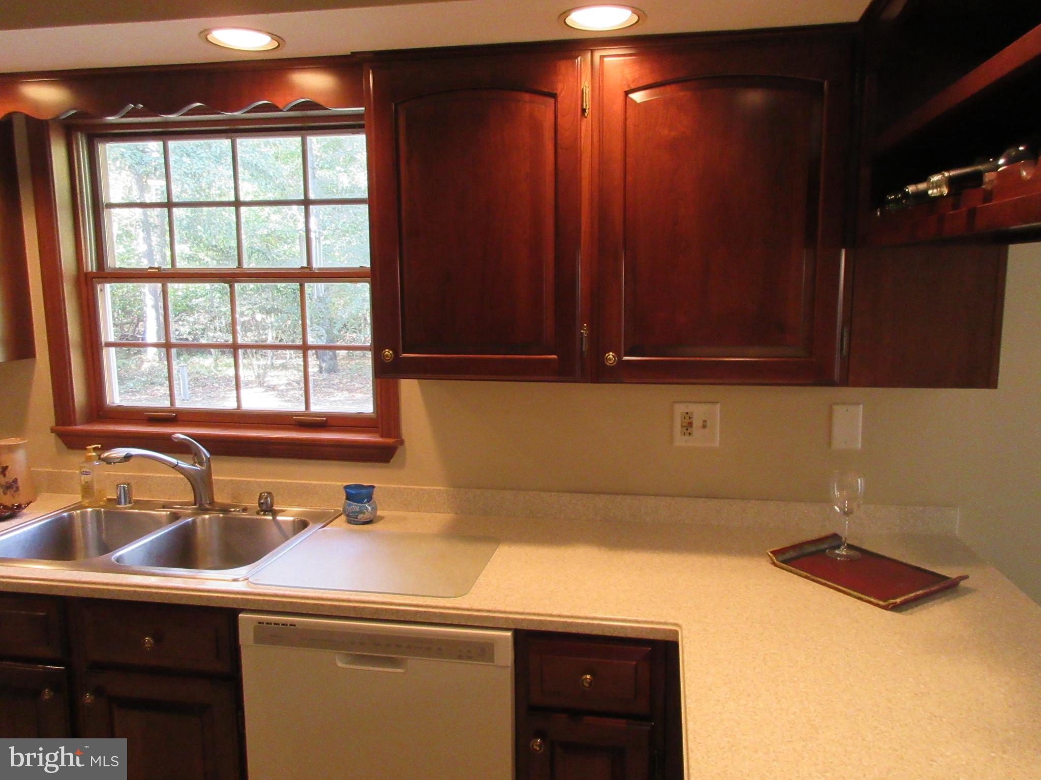 7782 Poplar Grove Road Severn, MD 21144 - Photo 7 of 52 High hats, built in wine rack, Corian