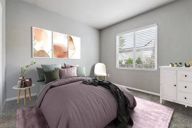 a bed room with a bed and a window